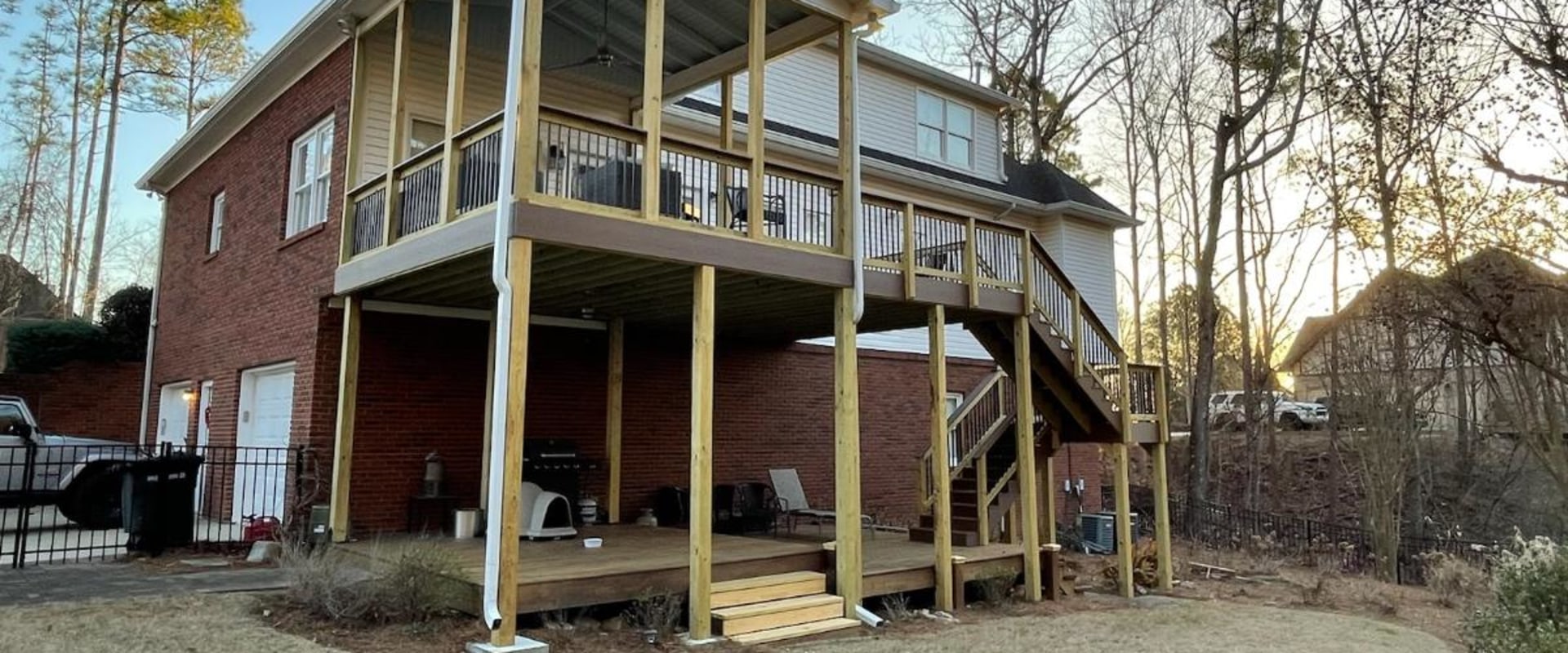 Replacing Damaged Boards: Improve Your Outdoor Living Space with Deck and Roof Renovations